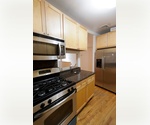 UNIQUE MASSIVE 6 BED/4 BATH DUPLEX WITH BALCONY. Live/work opportunity. 2 Separate entrances.